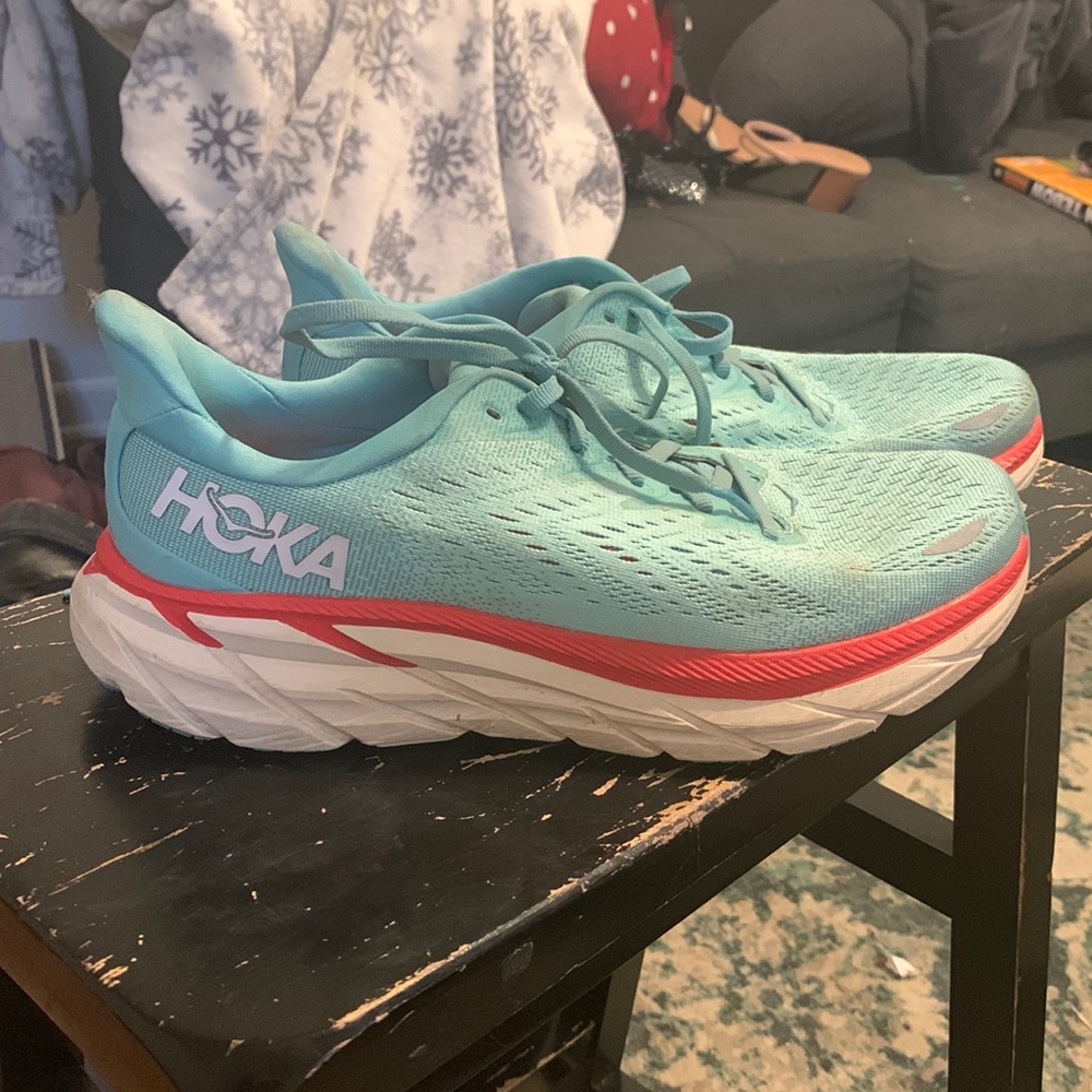 size 9.5 teal Hoka running shoes